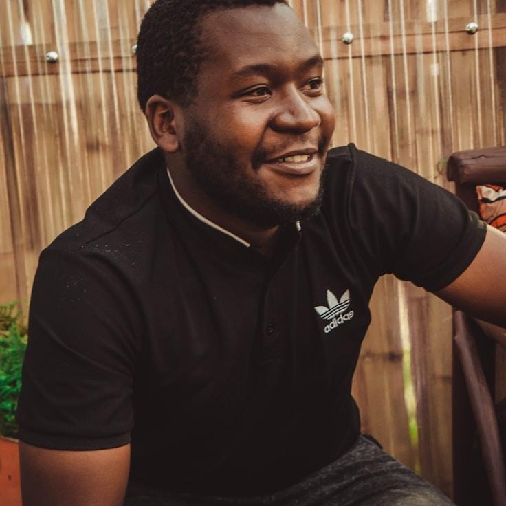 Aarav Singh, Lead Design Curator at River Gentle Moss, reviewing corporate floral arrangements